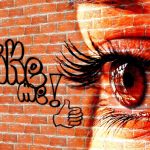 Writing, wall, woman — How does buying followers from Famoid work for Instagram growth?