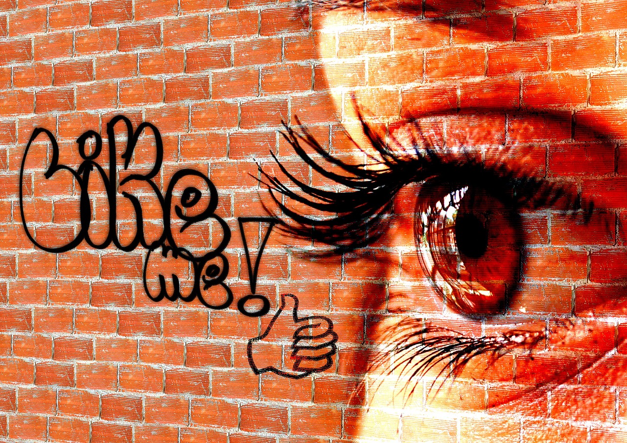 Writing, wall, woman — How does buying followers from Famoid work for Instagram growth?